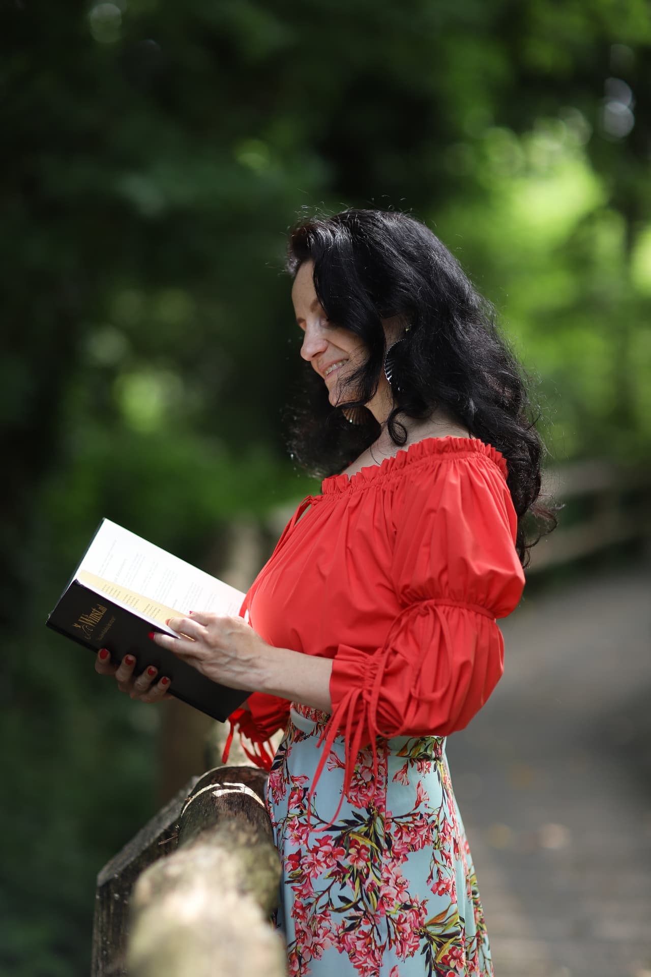 Portrait of the author reading in the garden